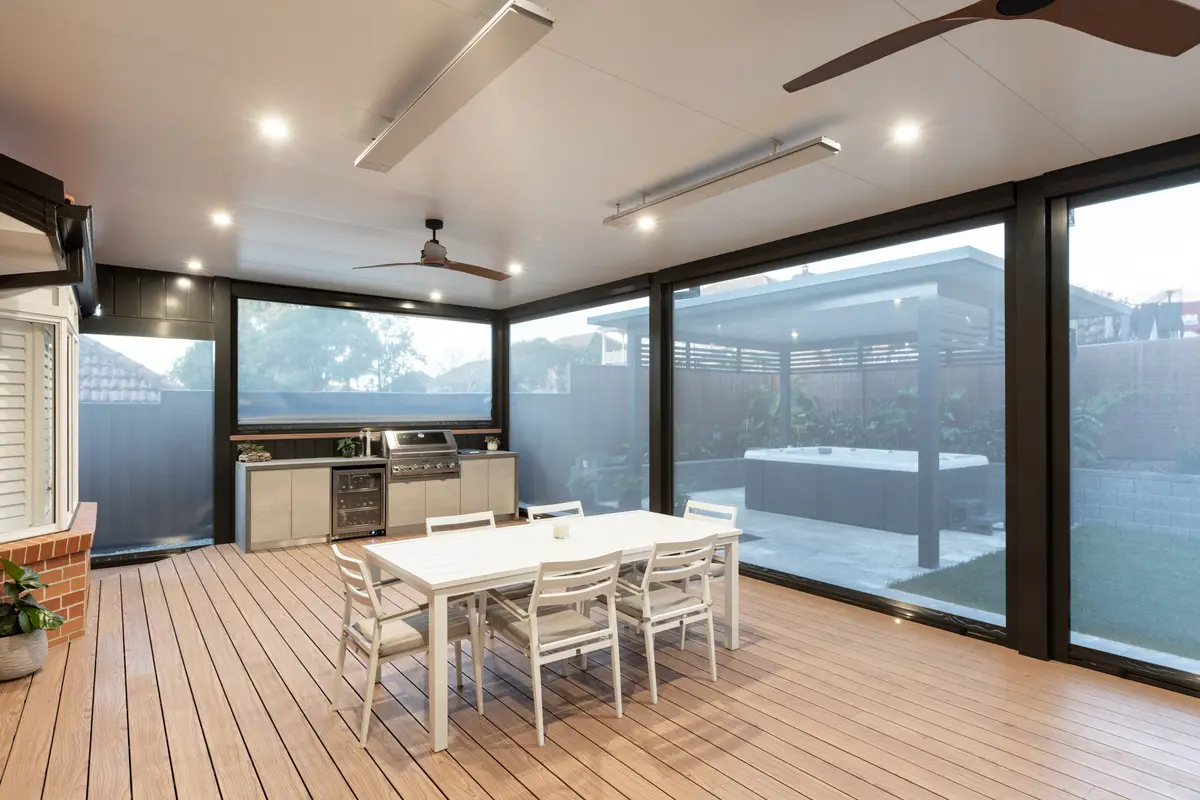 Inside an alfresco with the blinds closed — the mesh keeps the outlook while shutting out wind and insects