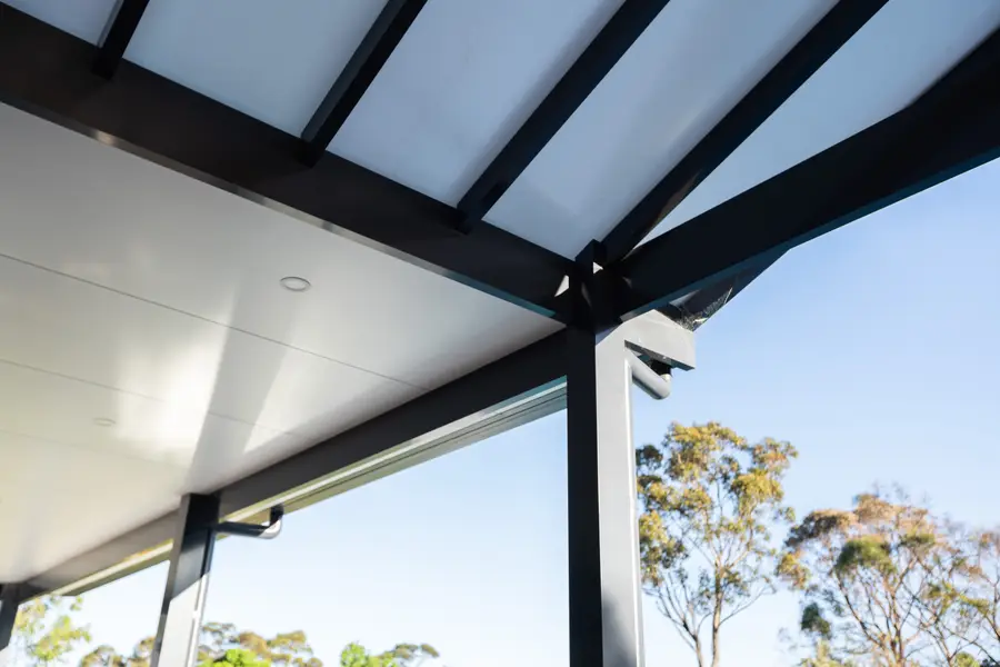 Detail of the junction where the gable roof meets the flat insulated ceiling