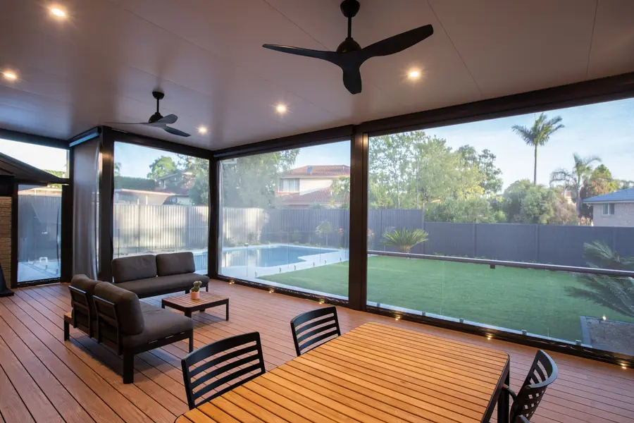 Downlights, fans and in-deck lighting under the pergola as the sun drops