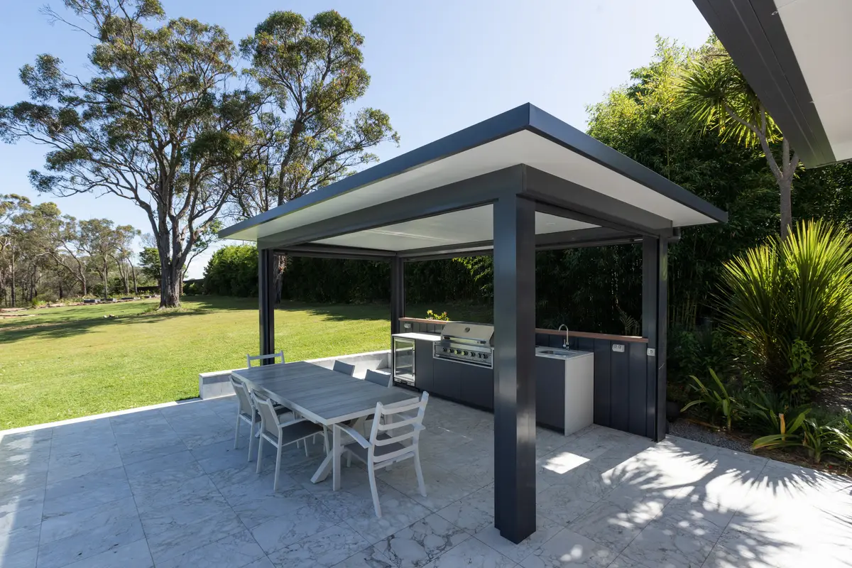 Freestanding cabana housing the outdoor kitchen, opening onto the lawn and gums, Annangrove