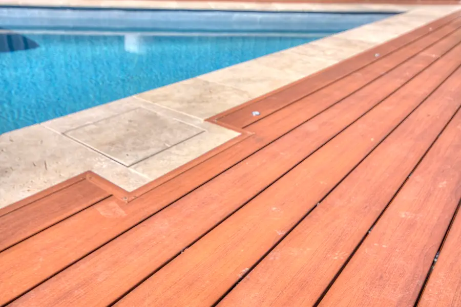 Close detail of a mitred aluminium deck corner cut around the pool coping