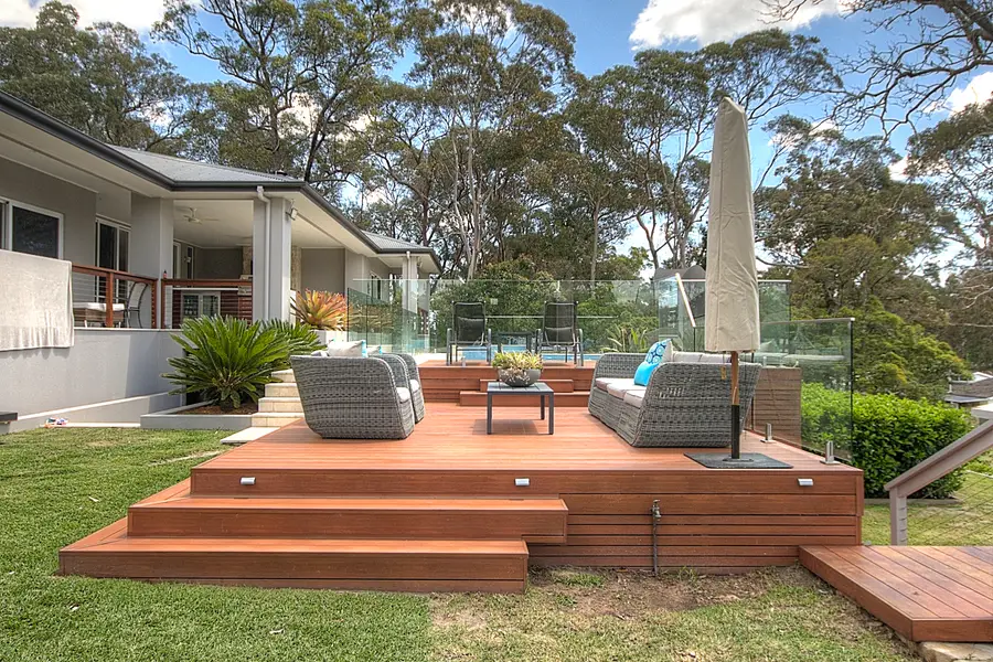 The aluminium deck and its steps from the lawn, in-floor lights along the risers