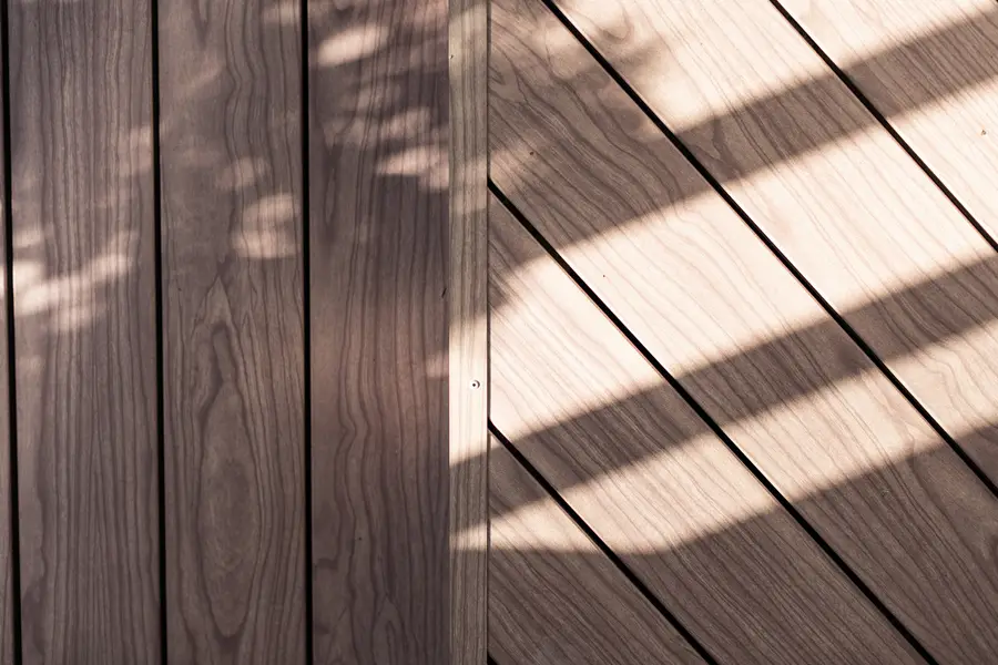 Timber-look aluminium deck boards in low afternoon sun