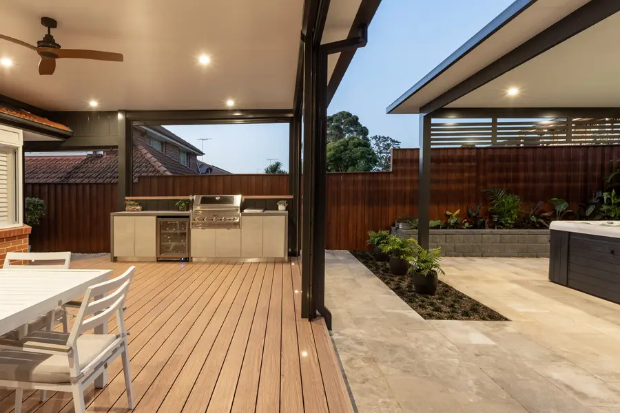 In-floor LED deck lights and ceiling downlights across the aluminium deck at dusk