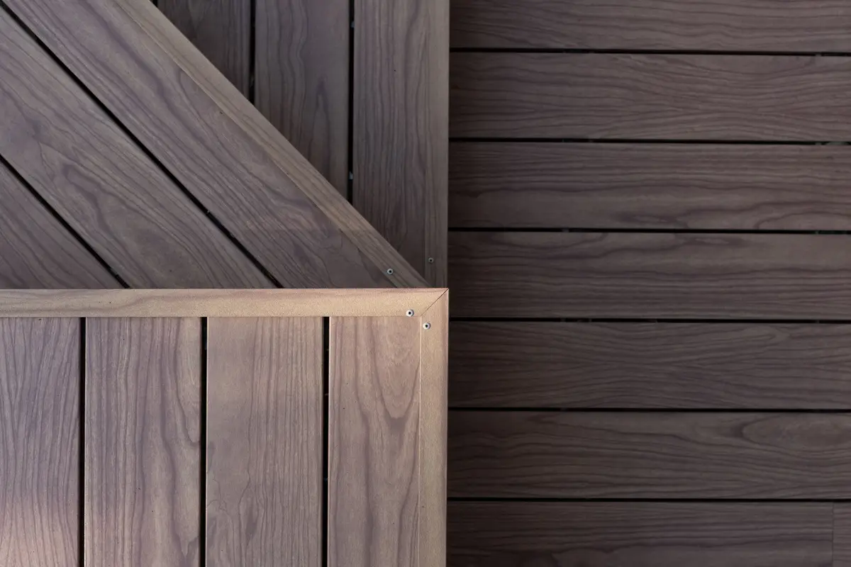 Close detail of a mitred deck step corner, the boards changing direction at the edge
