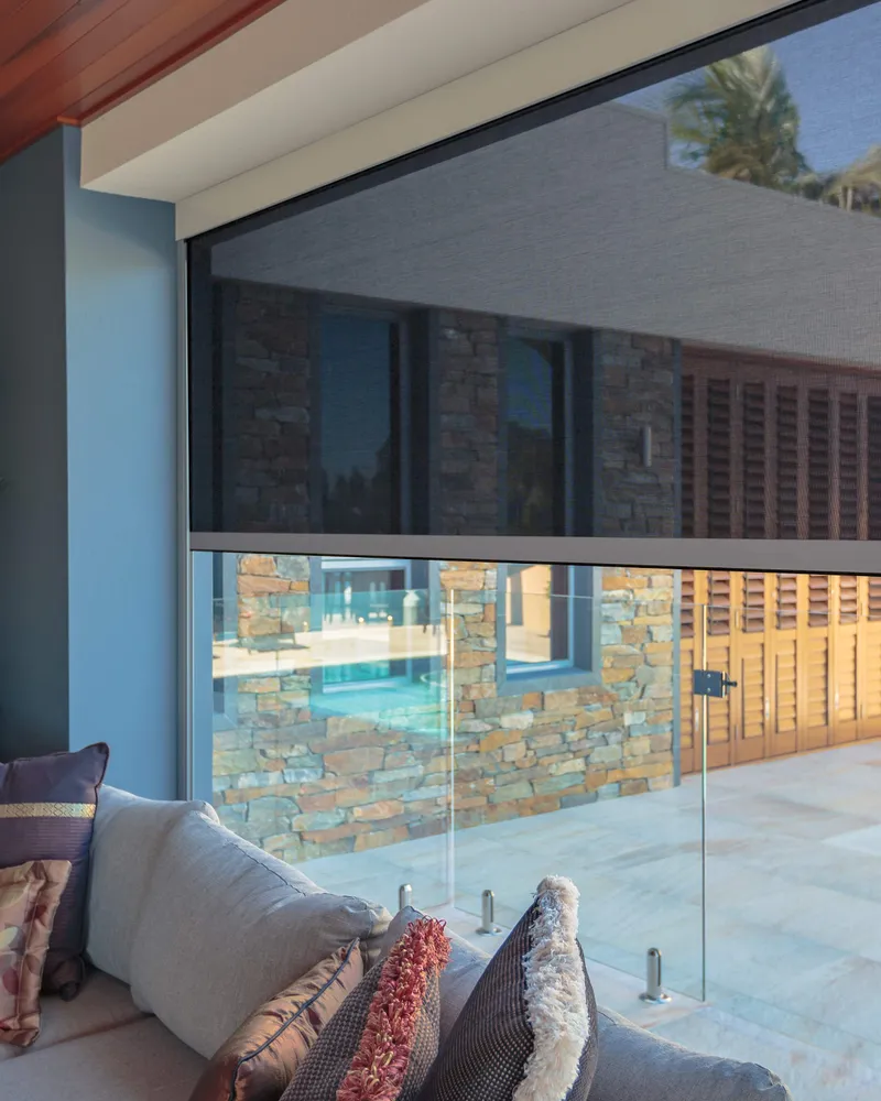 Track-guided outdoor blinds on a patio