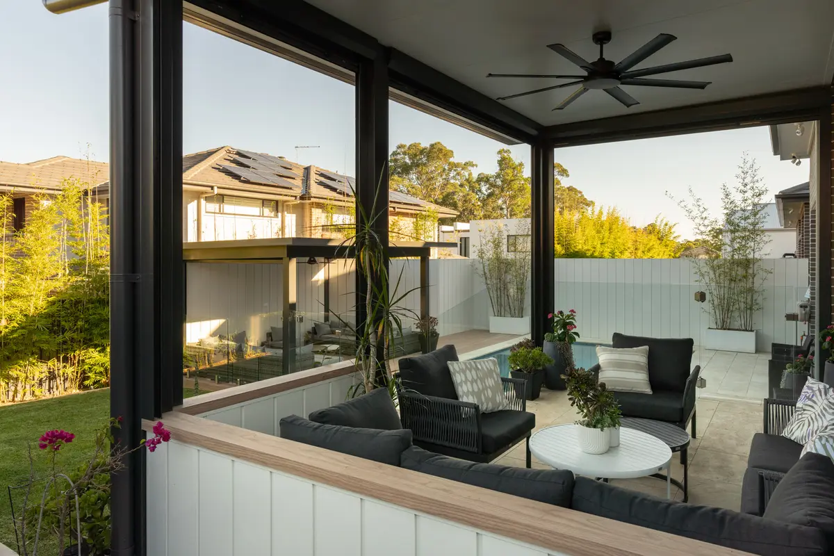 Clad wall used as a balustrade around the alfresco, finished with a timber-look top rail
