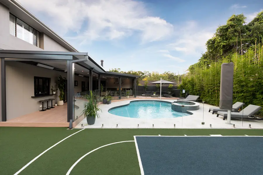 The alfresco, pool and half-court seen together from the far corner