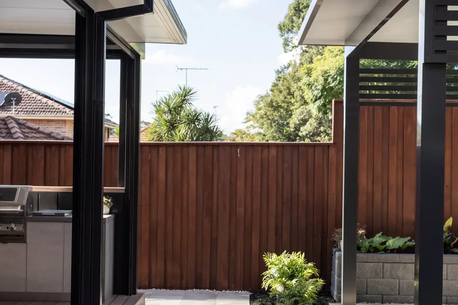 Paved courtyard between the attached patio and the freestanding cabana