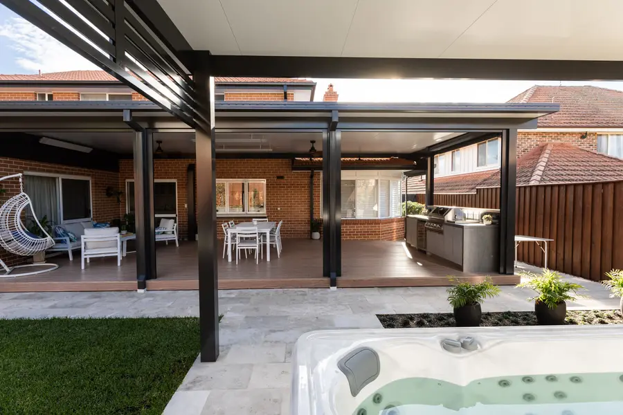 The insulated patio and deck seen from the spa, with overhead strip heaters