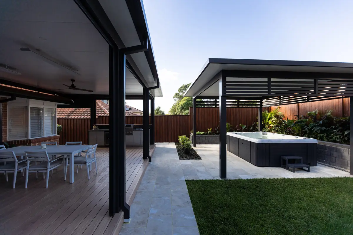 Deck and dining under the pergola, looking across to a freestanding roof over the swim spa, Castle Hill