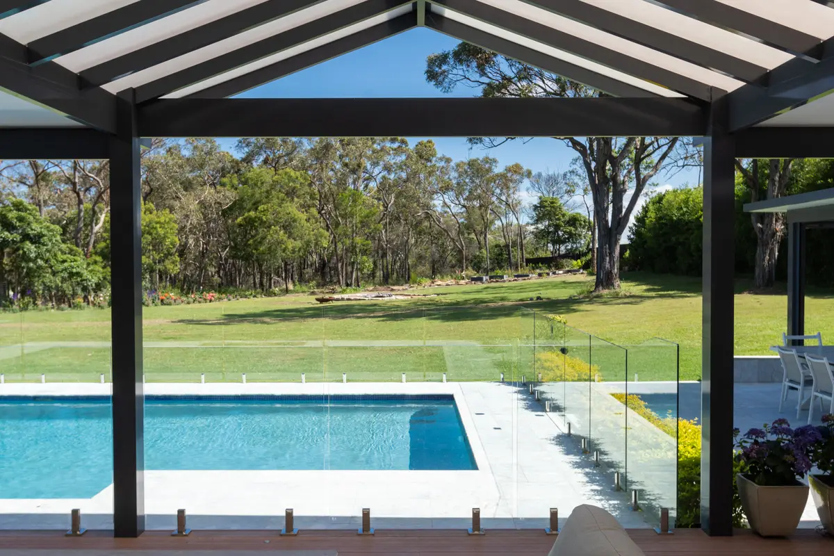 Exposed black beams, translucent roof panels and a timber-look fan over the deck, Annangrove