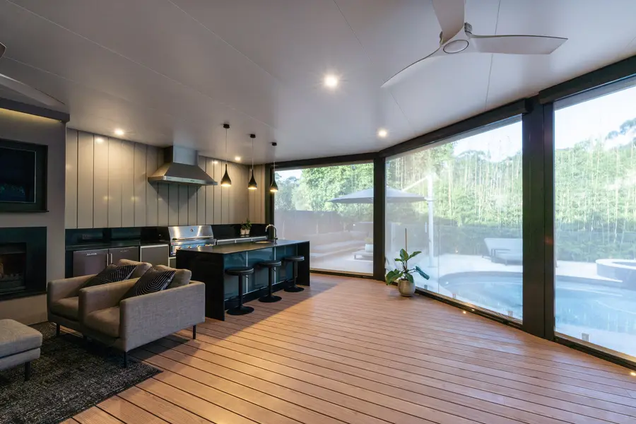 The kitchen island with the pool framed through the open corner