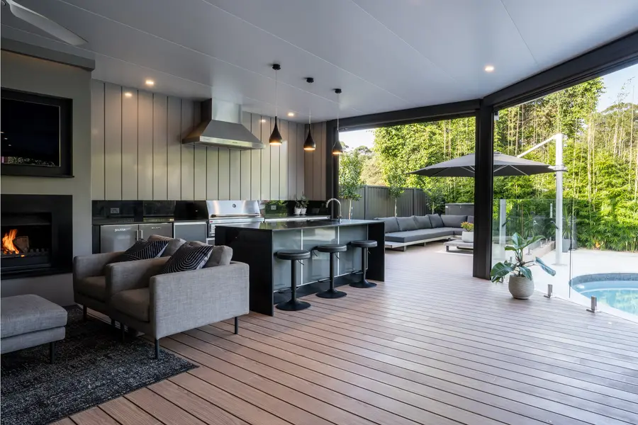 The lounge end of the outdoor room, opening to the daybed and pool