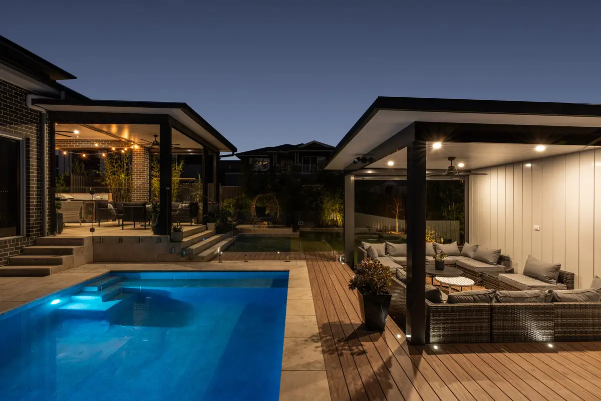 Directly overhead in daylight, the deck threading between pool and lawn, North Kellyville