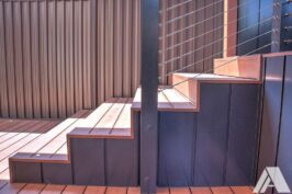 brown aluminium railing and stairs